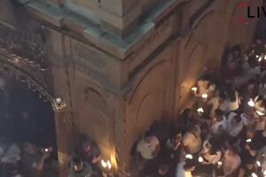 BLAGODATNI OGANJ ZAPALJEN U JERUSALIMU: Veliki broj pravoslavnih vernika posetio Hristov grob uz jake mere bezbednosti (VIDEO)