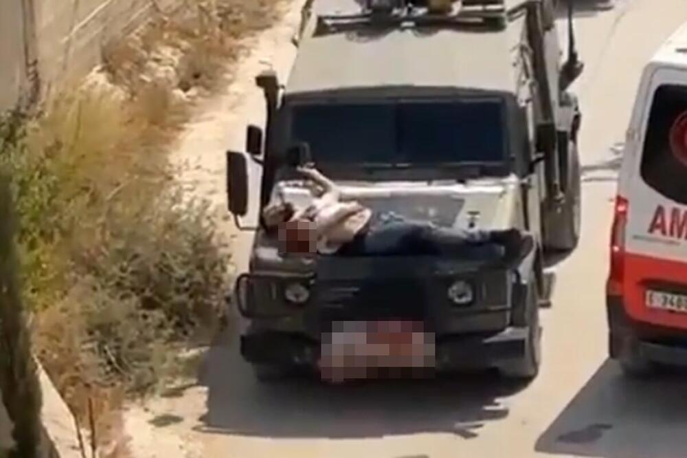 RANJENOG PALESTINCA VEZALI ZA HAUBU DŽIPA! Uznemirujući snimak izraelske vojske, iz IDF kažu da je narušen protokol (VIDEO)